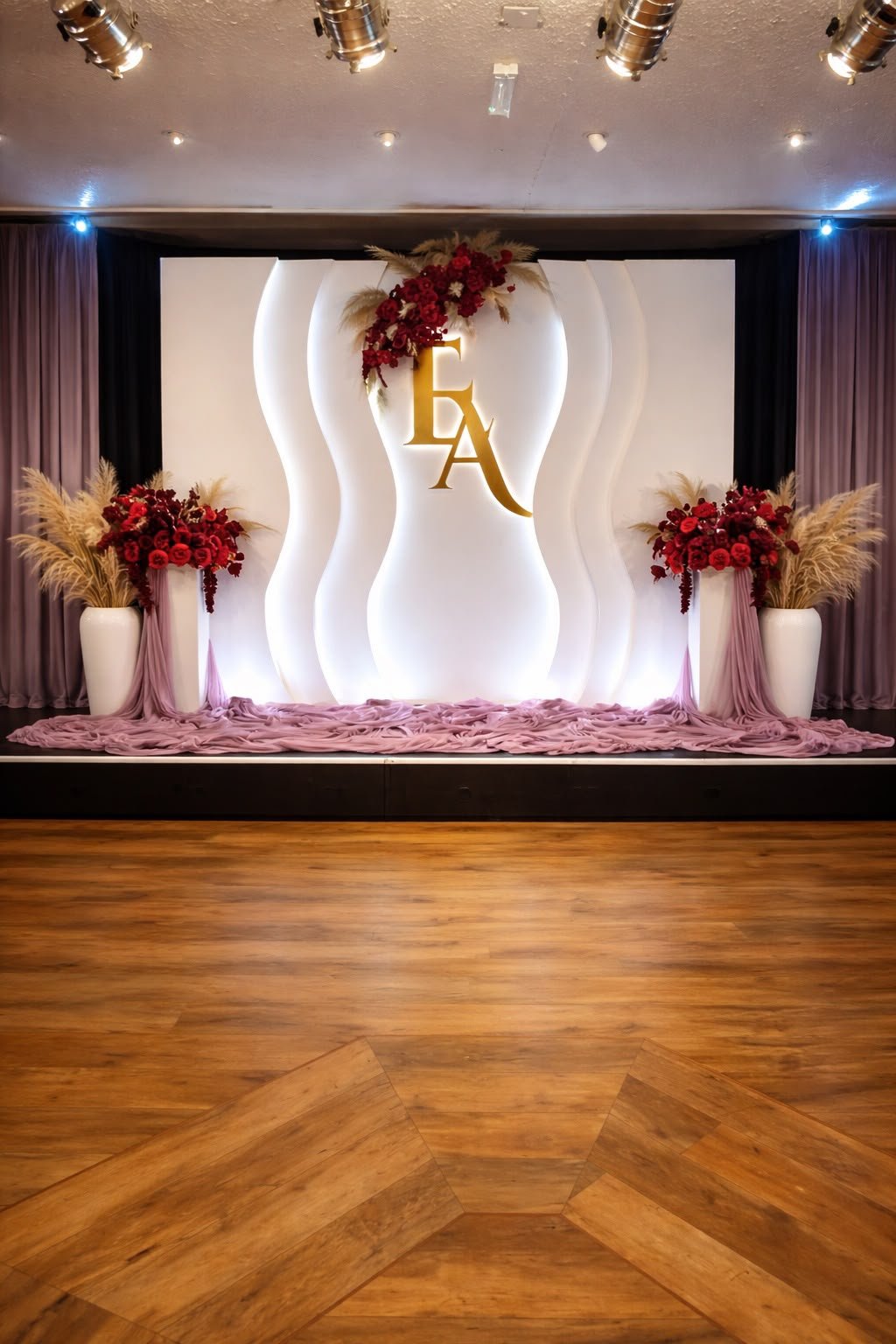 Bridal backdrop with monogram, roses and pampas grass